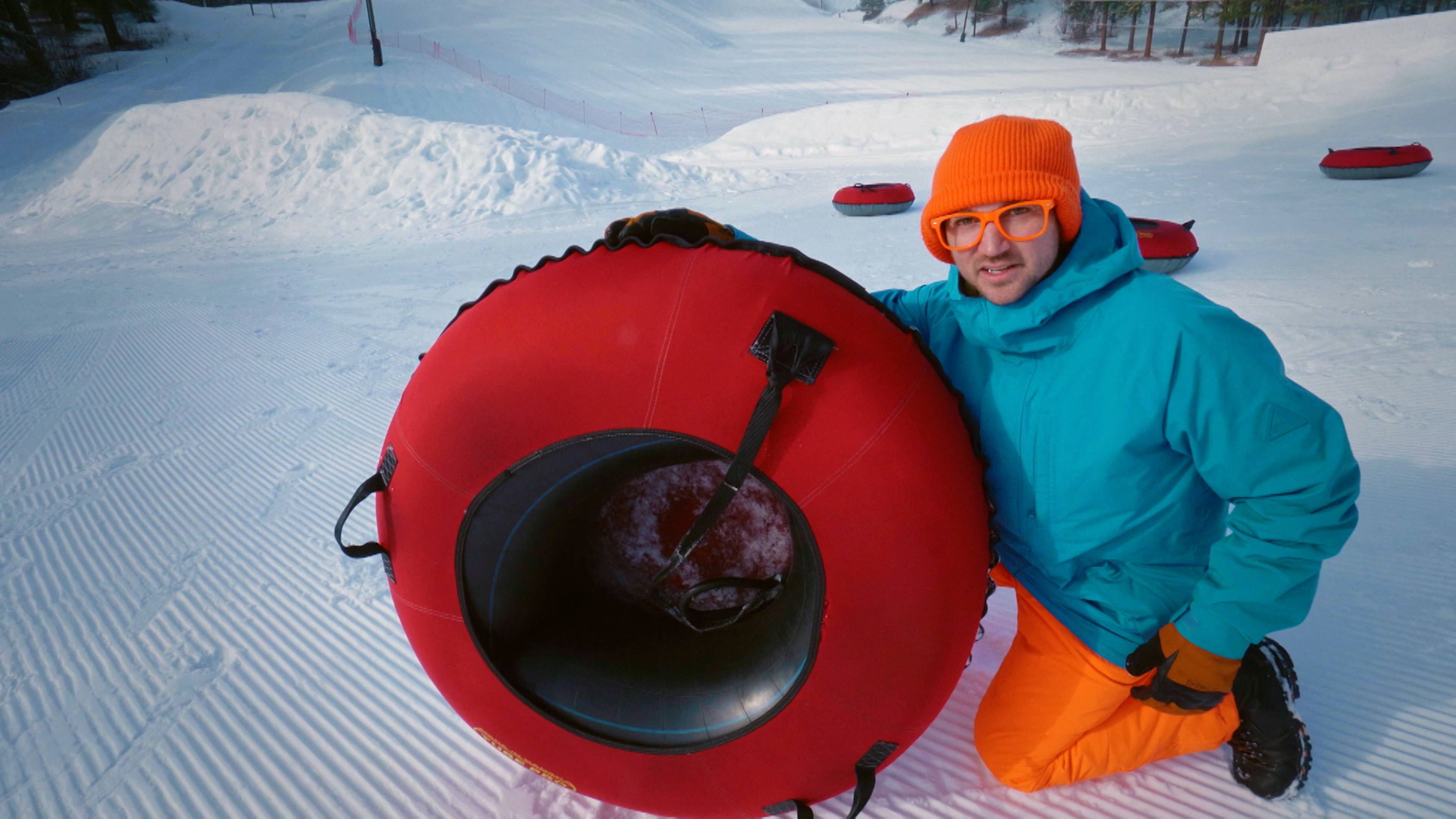 Playing In The Snow - Tubing Down The Mountain